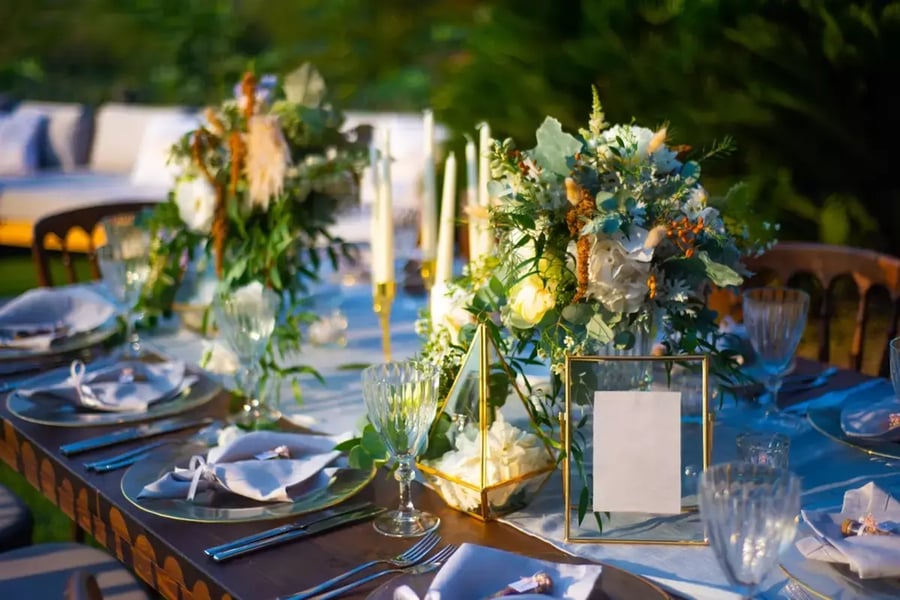 A beautifully decorated table at an outdoor dining event.