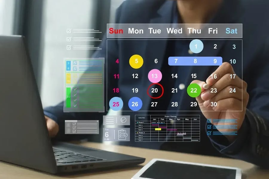 An event planner looking at a digital calendar.