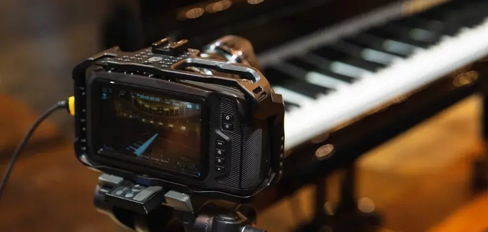Video camera system with tripods on a theater stage for live streaming